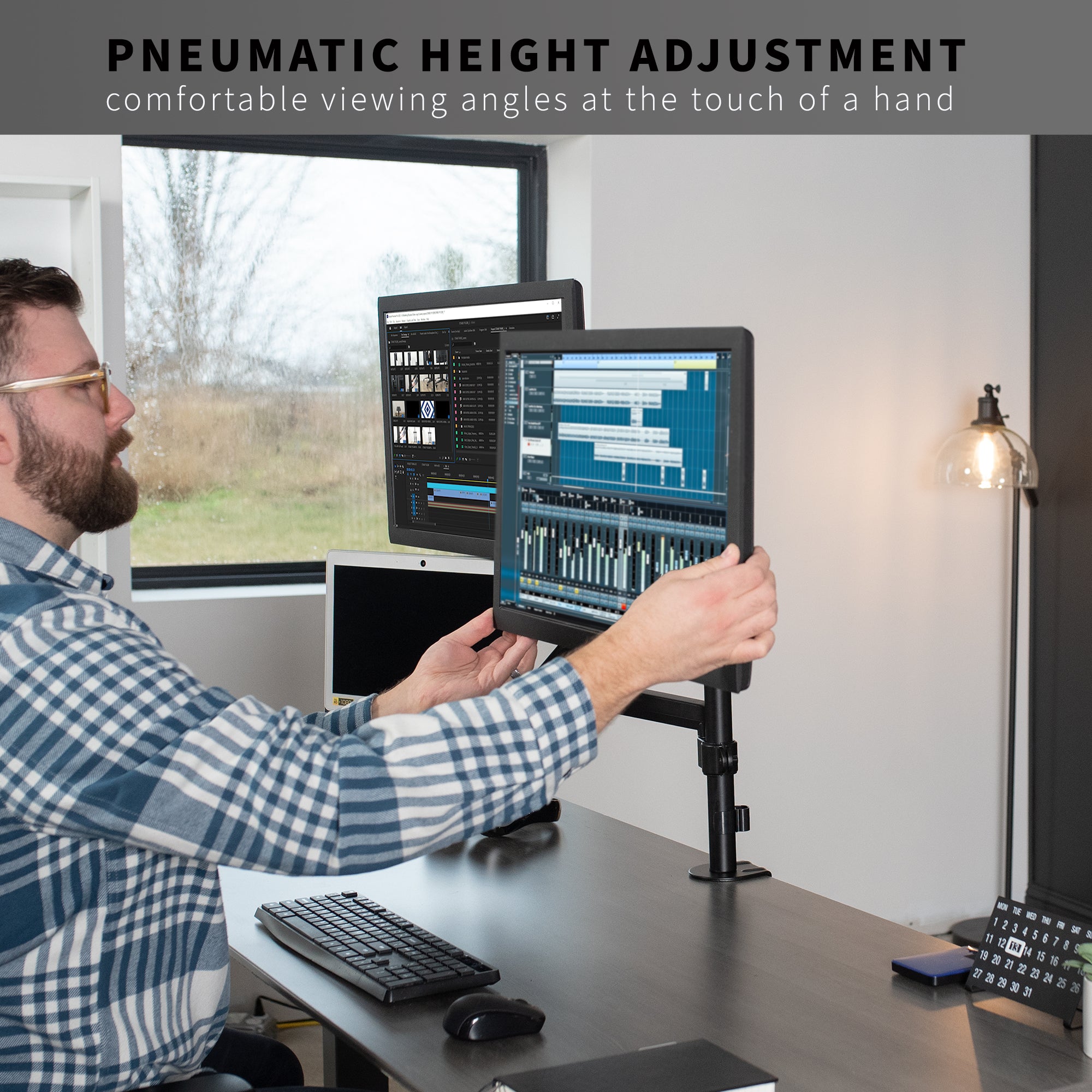 Pneumatic arm dual monitor and laptop desk mount that elevates your screens to a comfortable viewing height.