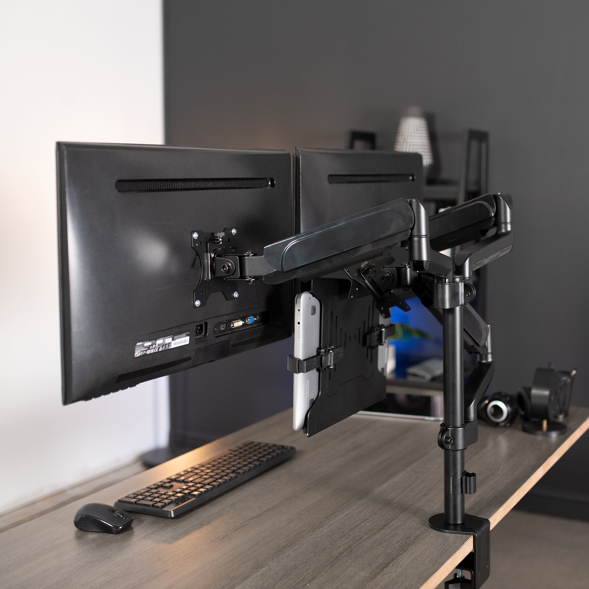 Pneumatic arm dual monitor and laptop desk mount that elevates your screens to a comfortable viewing height.
