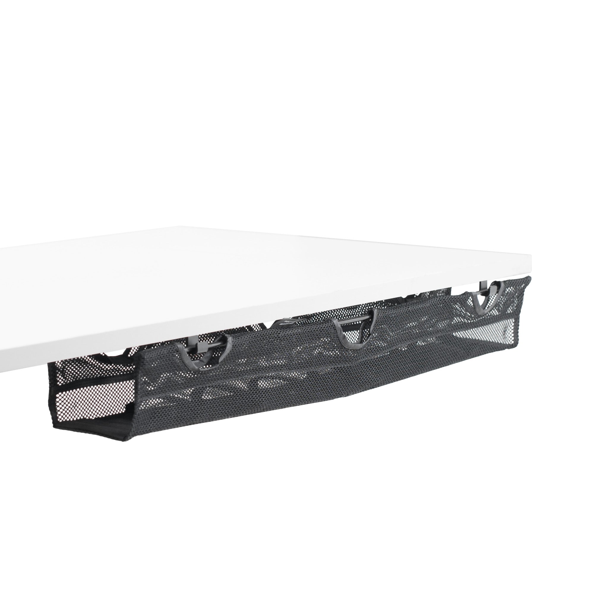 A black mesh cable management system with a power strip holder underneath a white desk.