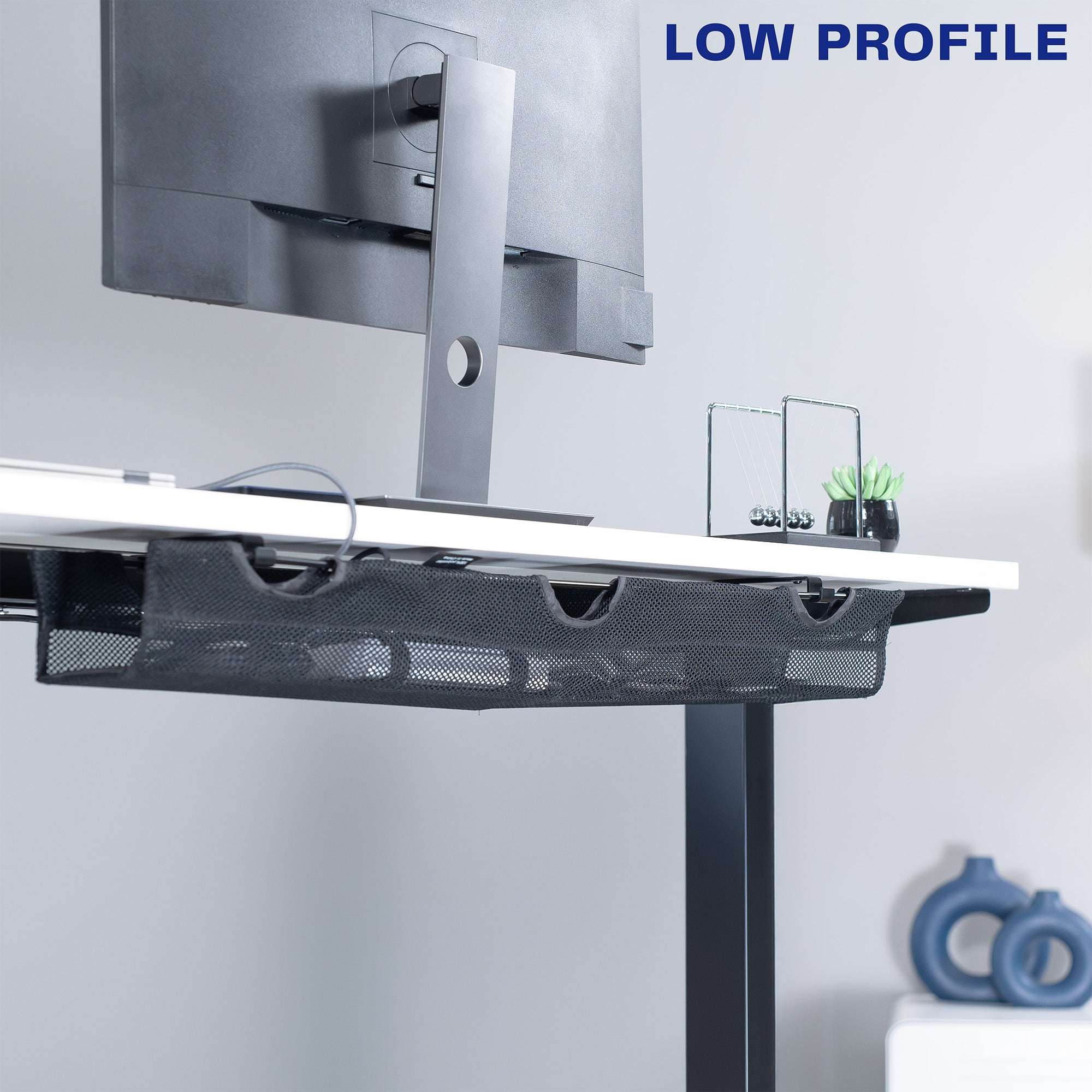 A black mesh cable management system with a low profile design. 