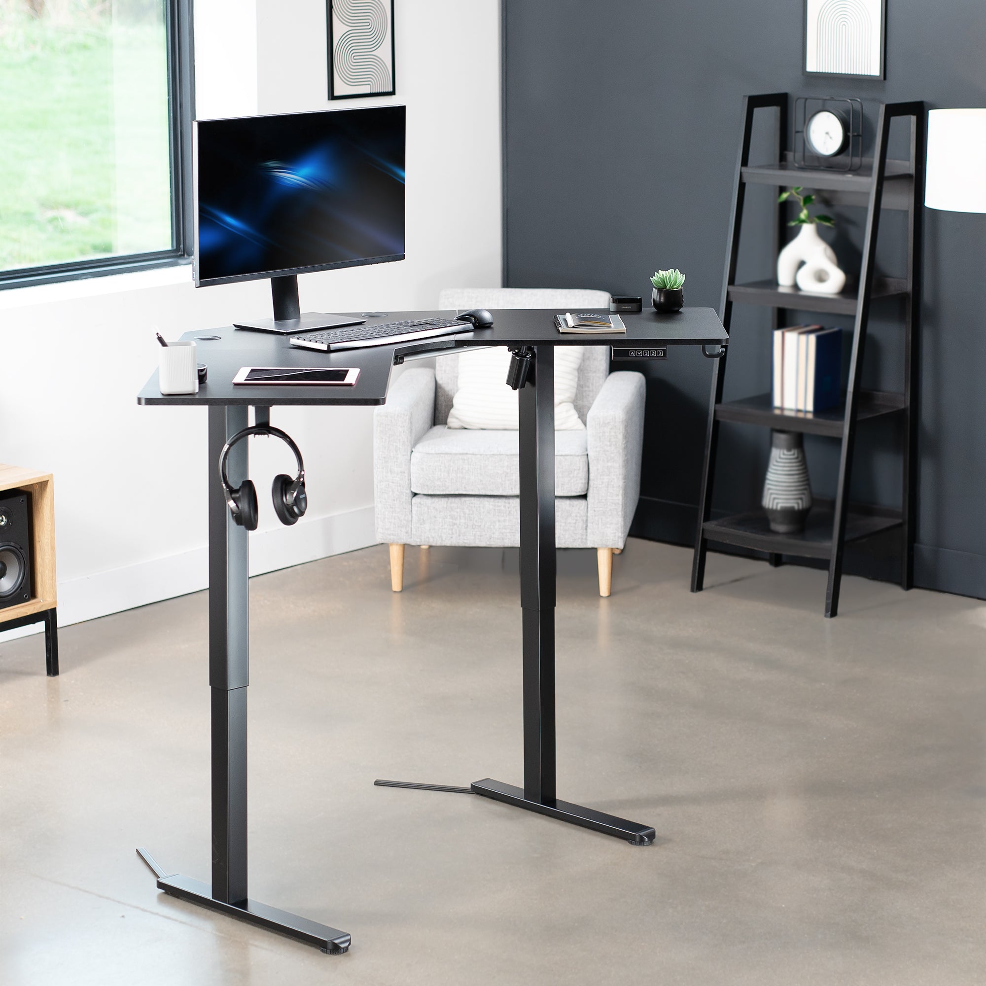 Heavy-duty electric height adjustable corner desk workstation for active sit or stand efficient workspace.