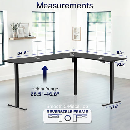 L-shaped desk with measurements labeled in a room with large windows.