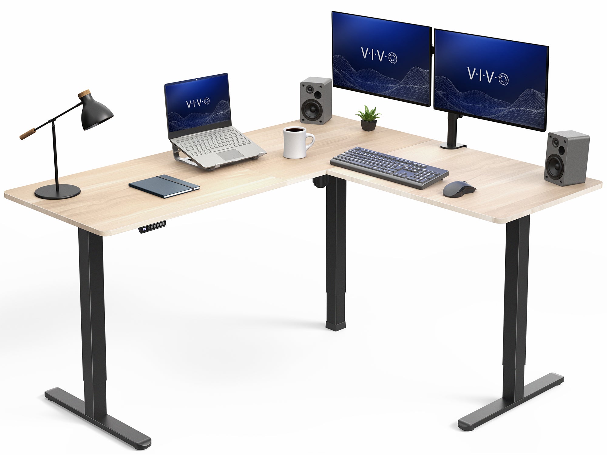 L-shaped desk with computer setup including monitors, keyboard, and speakers on a white background