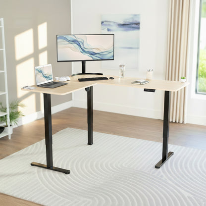 L-shaped desk with computer setup in a home office.