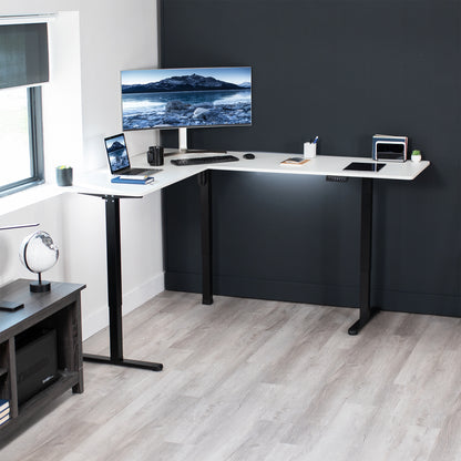 Electric heavy-duty corner desk workstation for modern office workspaces.