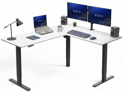 White L-shaped desk with computer setup including monitors, laptop, keyboard, and speakers on a white background.