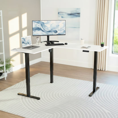Modern home office with a white L-shaped desk, computer setup, and decor.