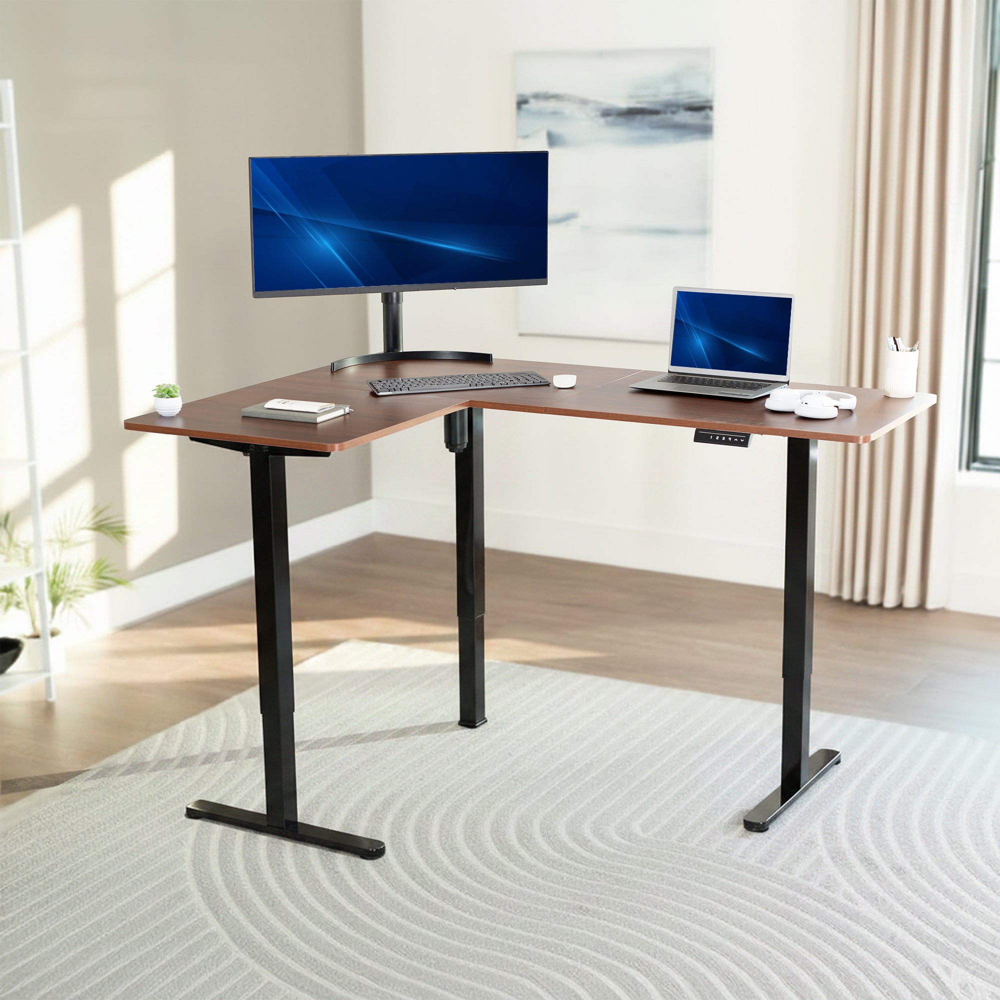 L-shaped desk with computer setup in a bright room