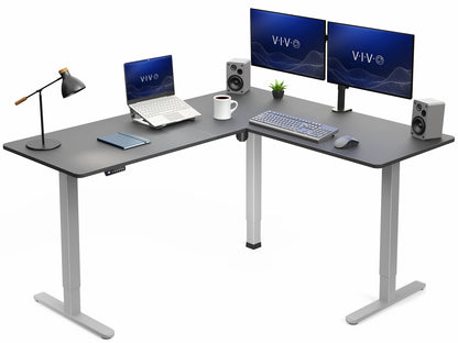 L-shaped desk with computer setup including monitors, keyboard, and speakers on a white background