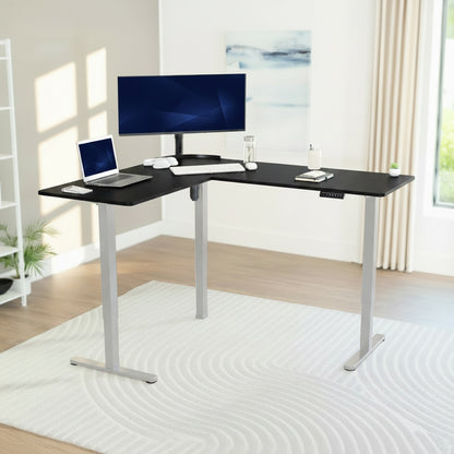 Modern L-shaped desk with computer setup in a bright room