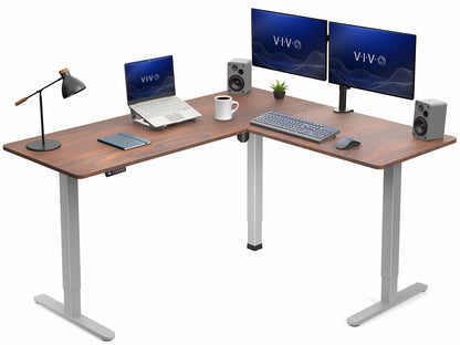 L-shaped desk with computer setup including monitors, keyboard, and speakers on a white background