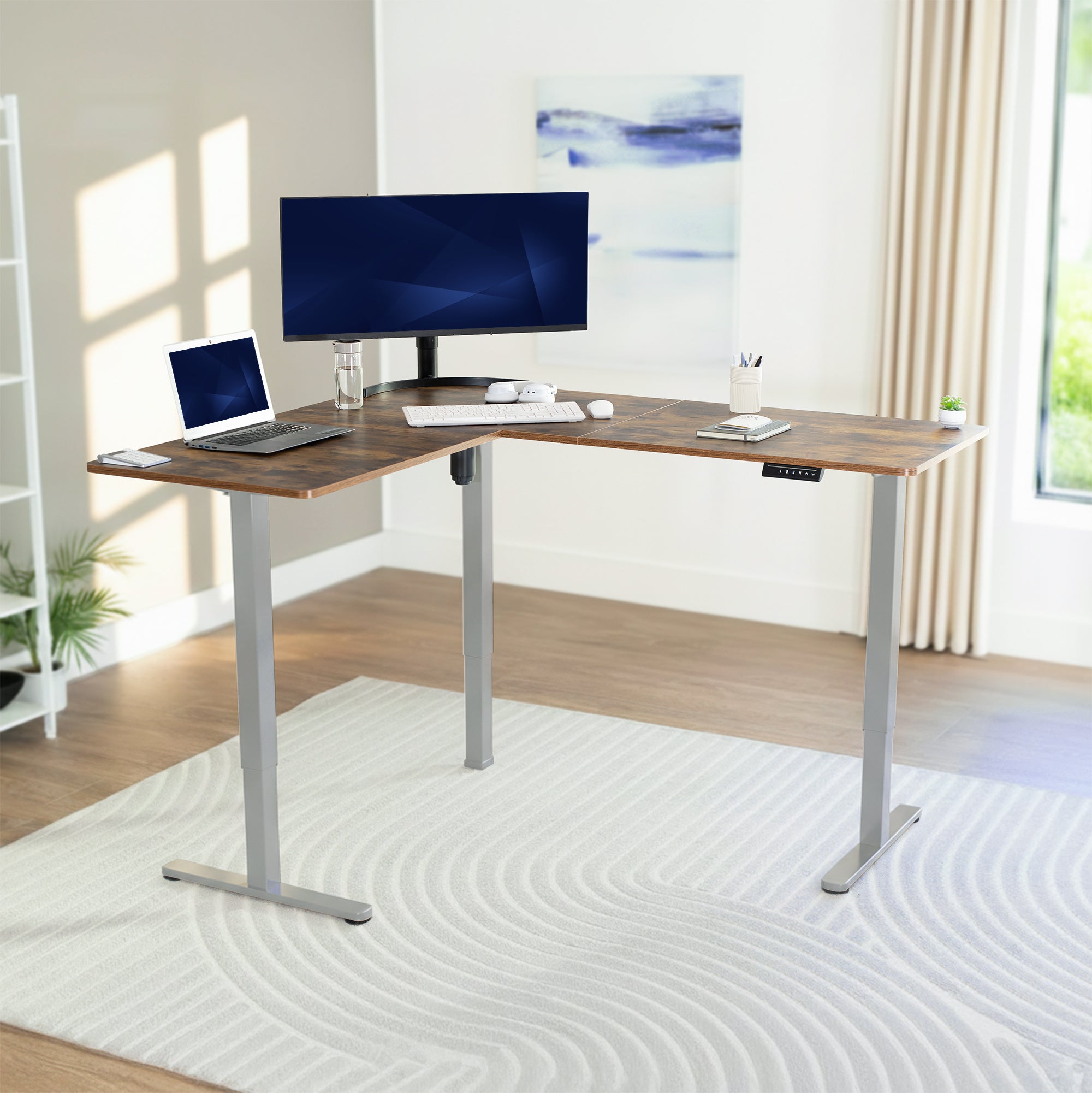 Modern L-shaped desk with computer setup in a bright room