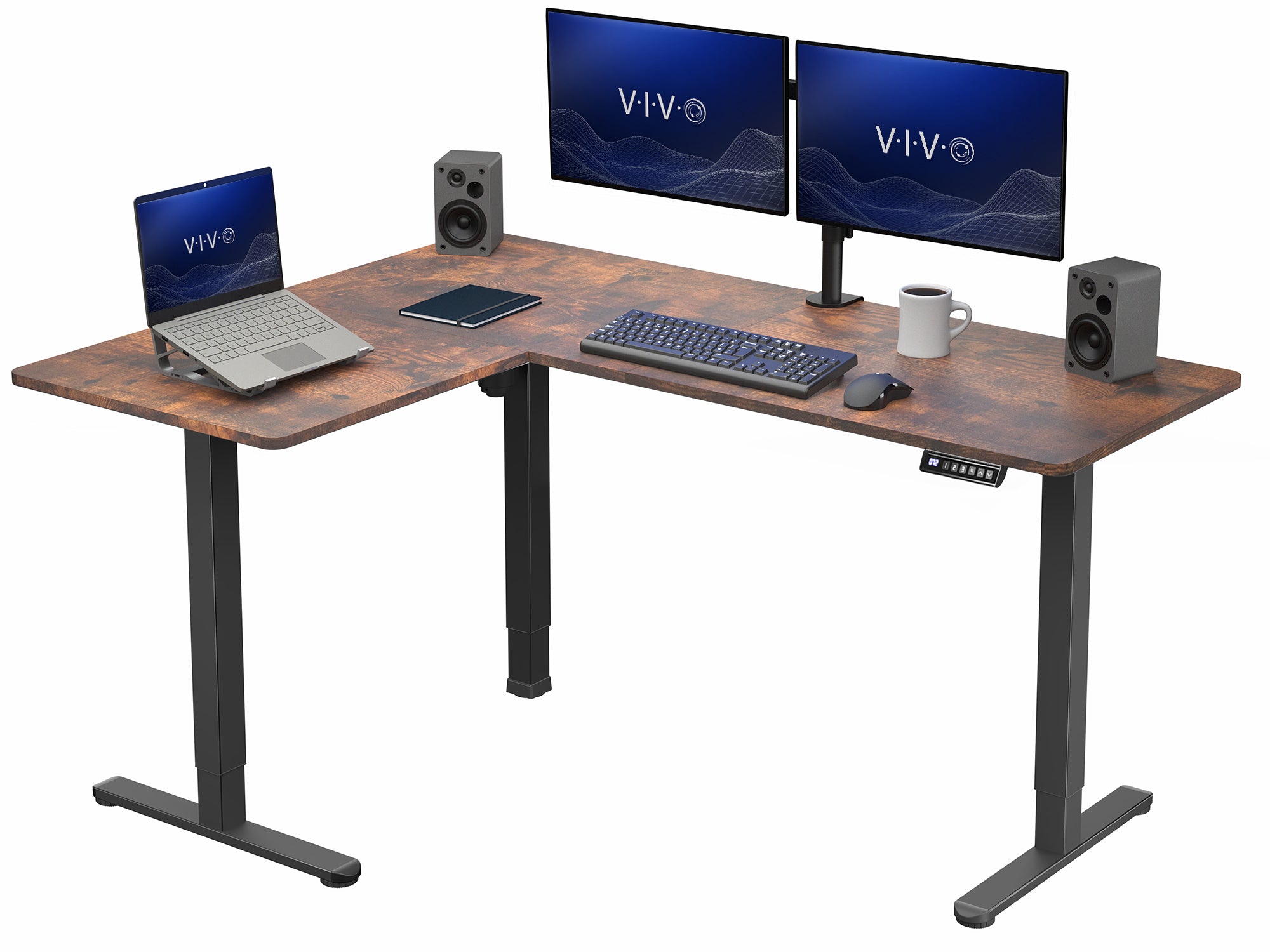Wooden L-shaped desk with computer setup including two monitors, laptop, keyboard, and speakers on a white background.