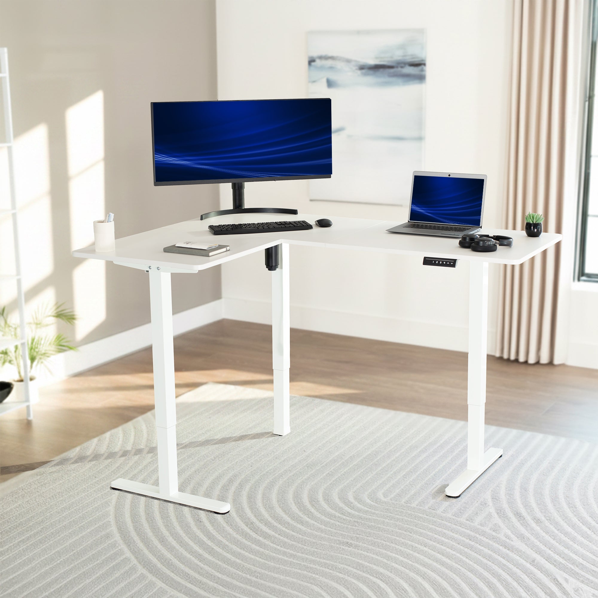 White L-shaped desk with computer setup in a bright room