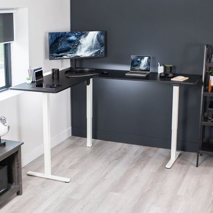 Electric heavy-duty corner desk workstation for modern office workspaces.