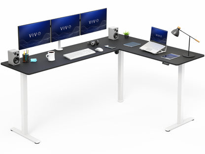 L-shaped standing desk with computer setup on a white background