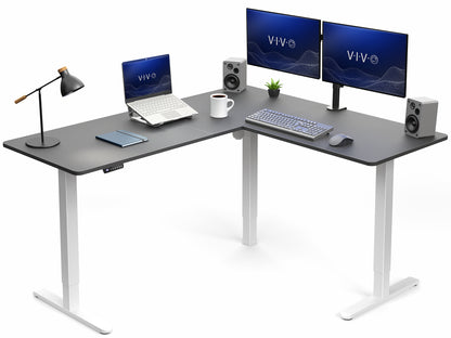Modern L-shaped desk with computer setup including monitors, keyboard, and speakers on a white background.