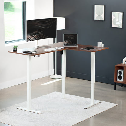 Electric heavy-duty corner desk workstation for modern office workspaces.