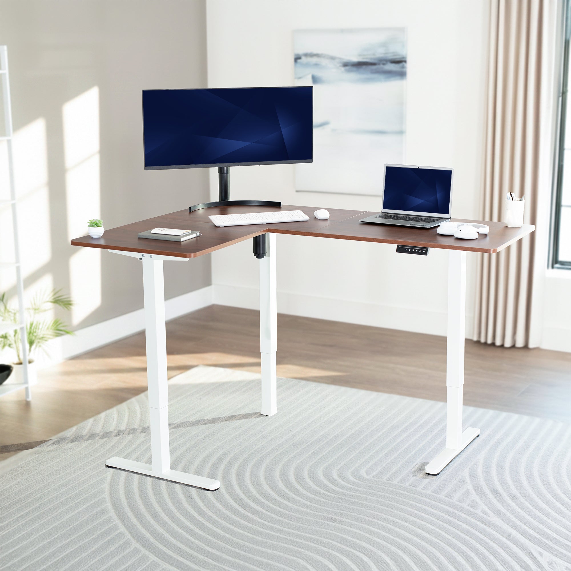 Corner l-shaped desk with computer setup in a bright room