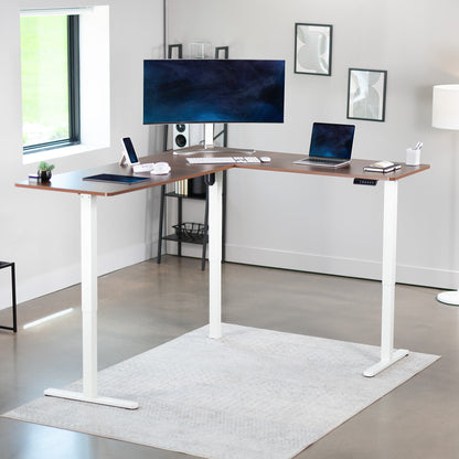 Electric heavy-duty corner desk workstation for modern office workspaces.