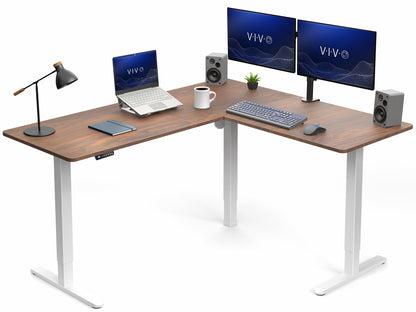 Wooden L-shaped desk with computer setup including monitors, keyboard, and laptop on a white background