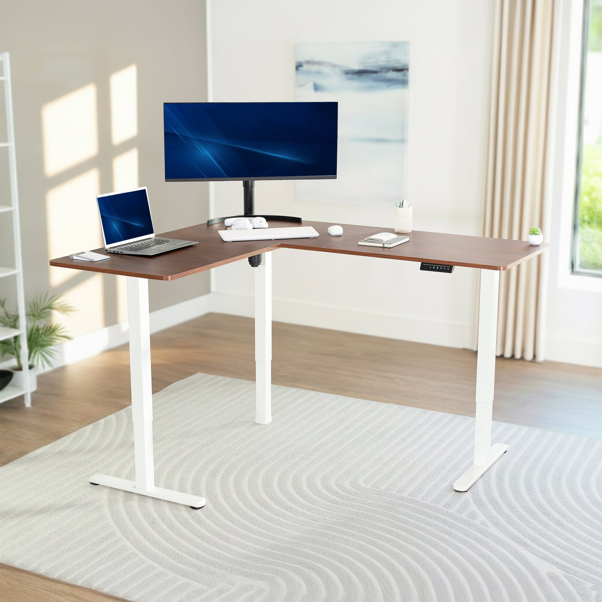 Modern L-shaped desk with computer setup in a bright room