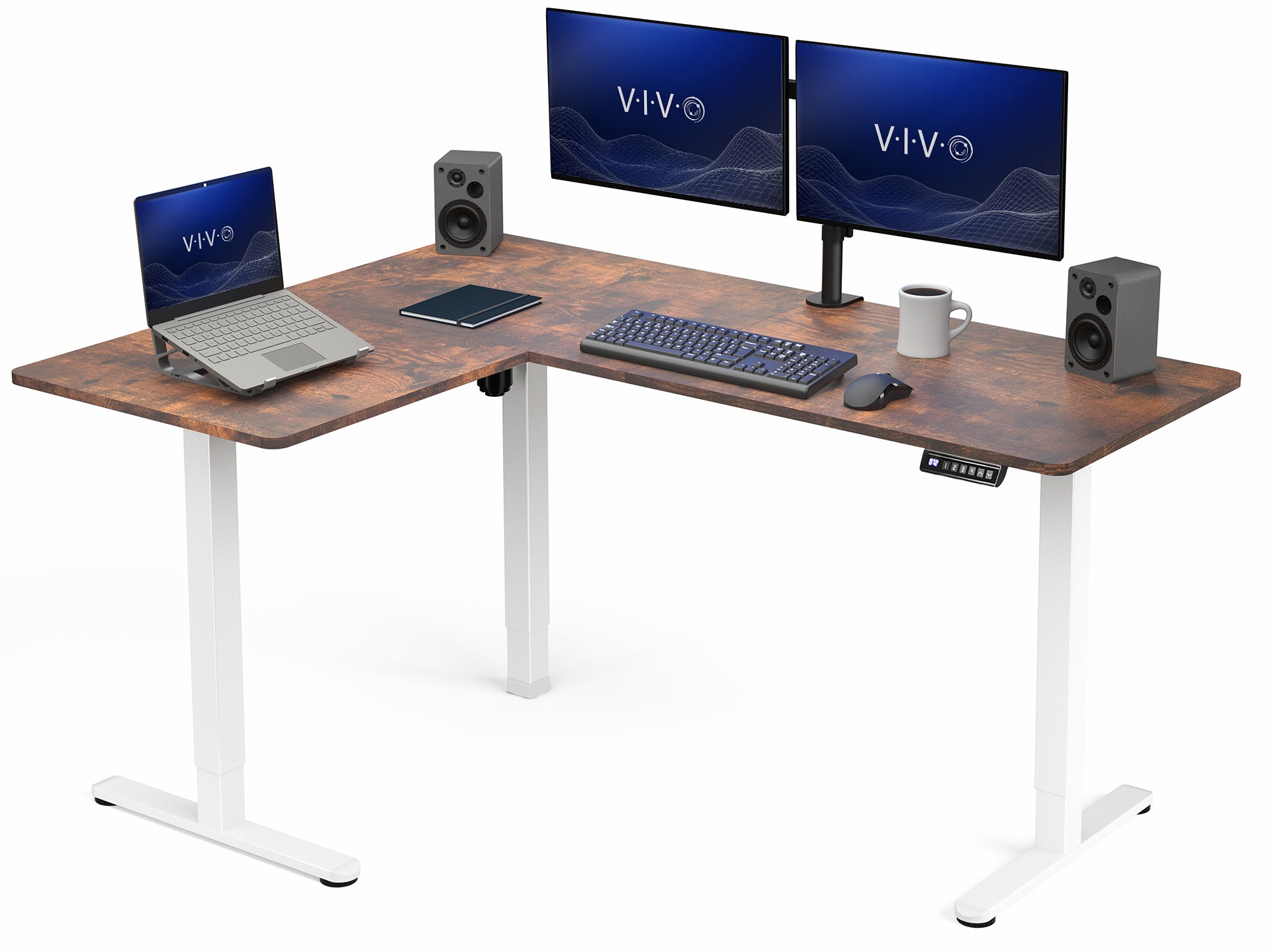 Wooden L-shaped desk with computer setup including monitors, laptop, keyboard, and speakers on a white background.
