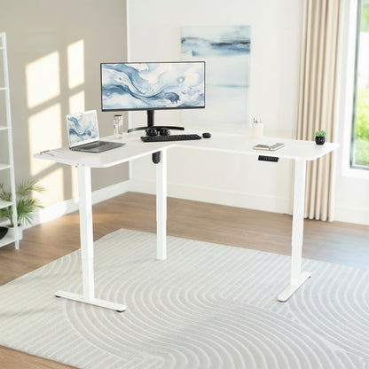 White L-shaped desk with computer setup in a bright room