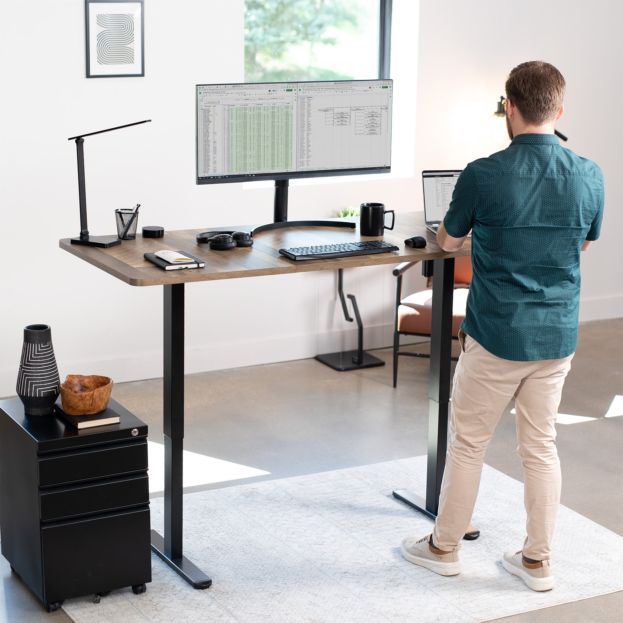 Wide surface sturdy sit or stand active workstation with adjustable height using 2 button control panel.