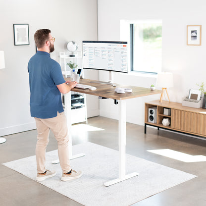 Wide surface sturdy sit or stand active workstation with adjustable height using 2 button control panel.