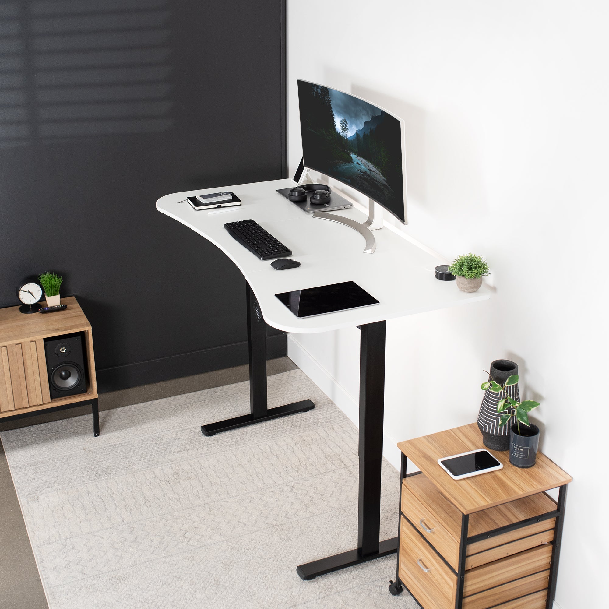 Sit to stand height adjustable electric desk with push button memory controller for ergonomic office workstation.