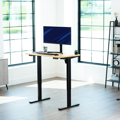 Sturdy ergonomic sit or stand active desk workstation with adjustable height using smart control panel.
