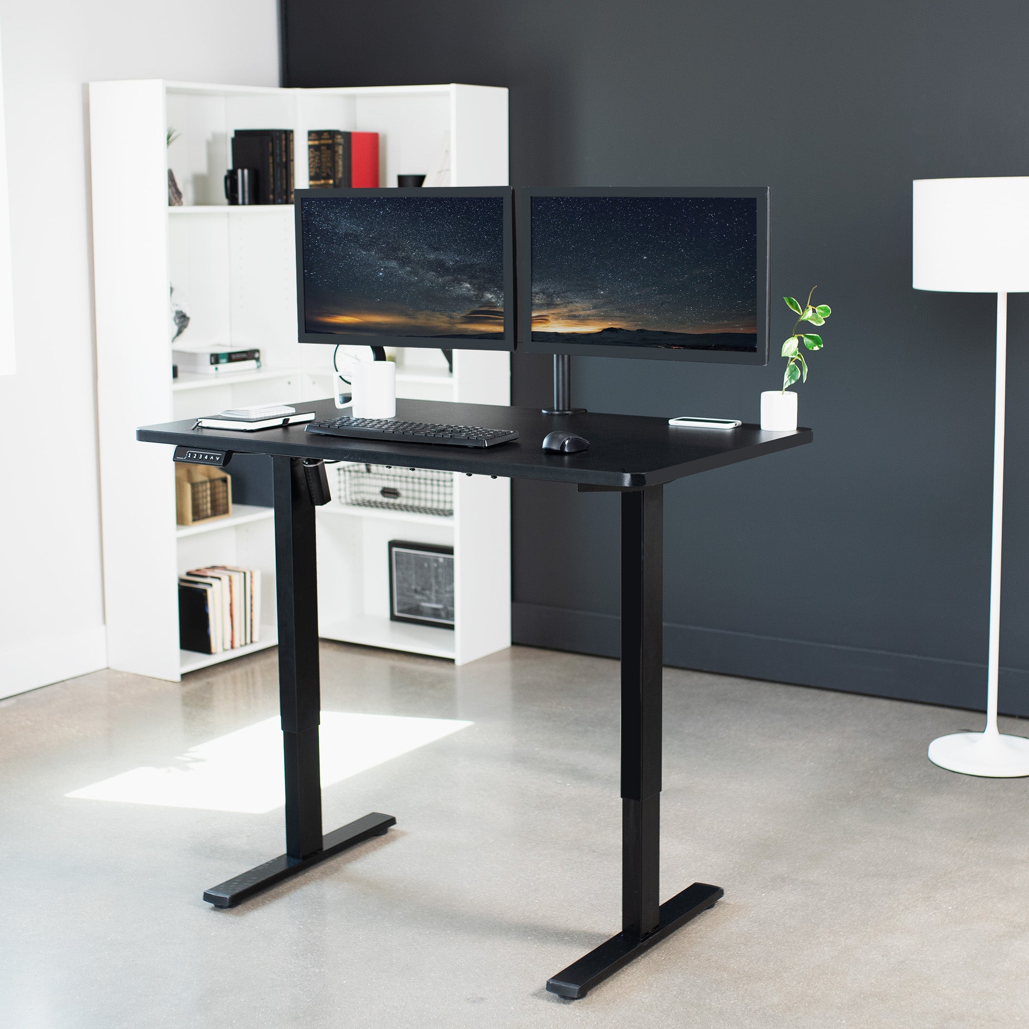 Sturdy ergonomic sit or stand active desk workstation with adjustable height using smart control panel.