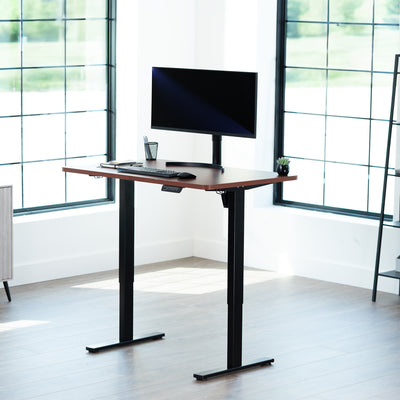 Sturdy ergonomic sit or stand active desk workstation with adjustable height using smart control panel.