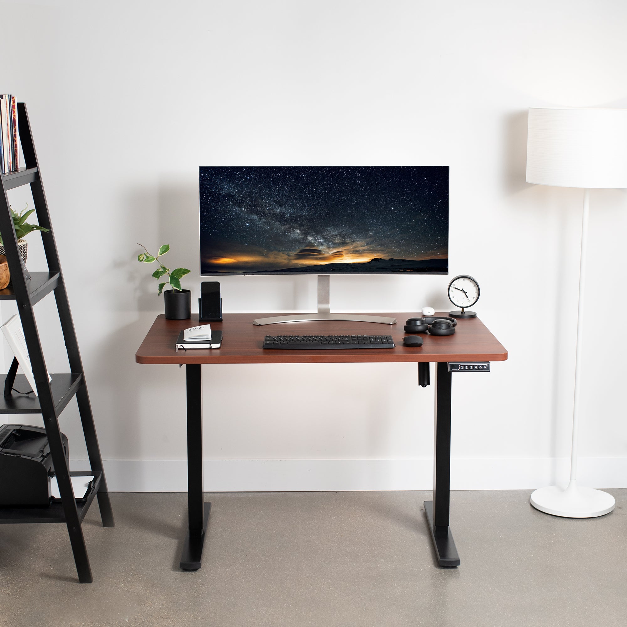 Sturdy ergonomic sit or stand active desk workstation with adjustable height using smart control panel.