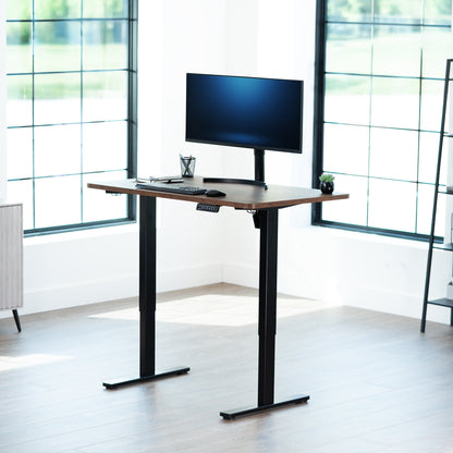 Sturdy ergonomic sit or stand active desk workstation with adjustable height using smart control panel.