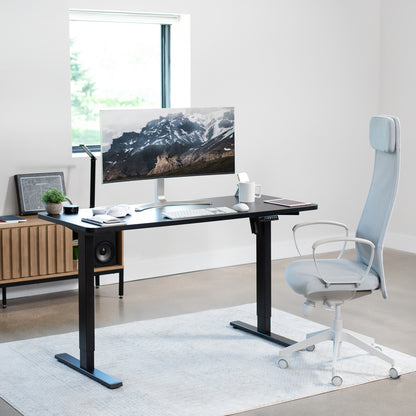 Standing height adjustable electric desk from VIVO. 