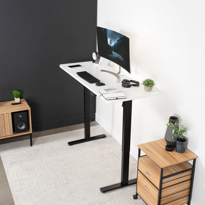 Sturdy ergonomic sit or stand active desk workstation with adjustable height using smart control panel.