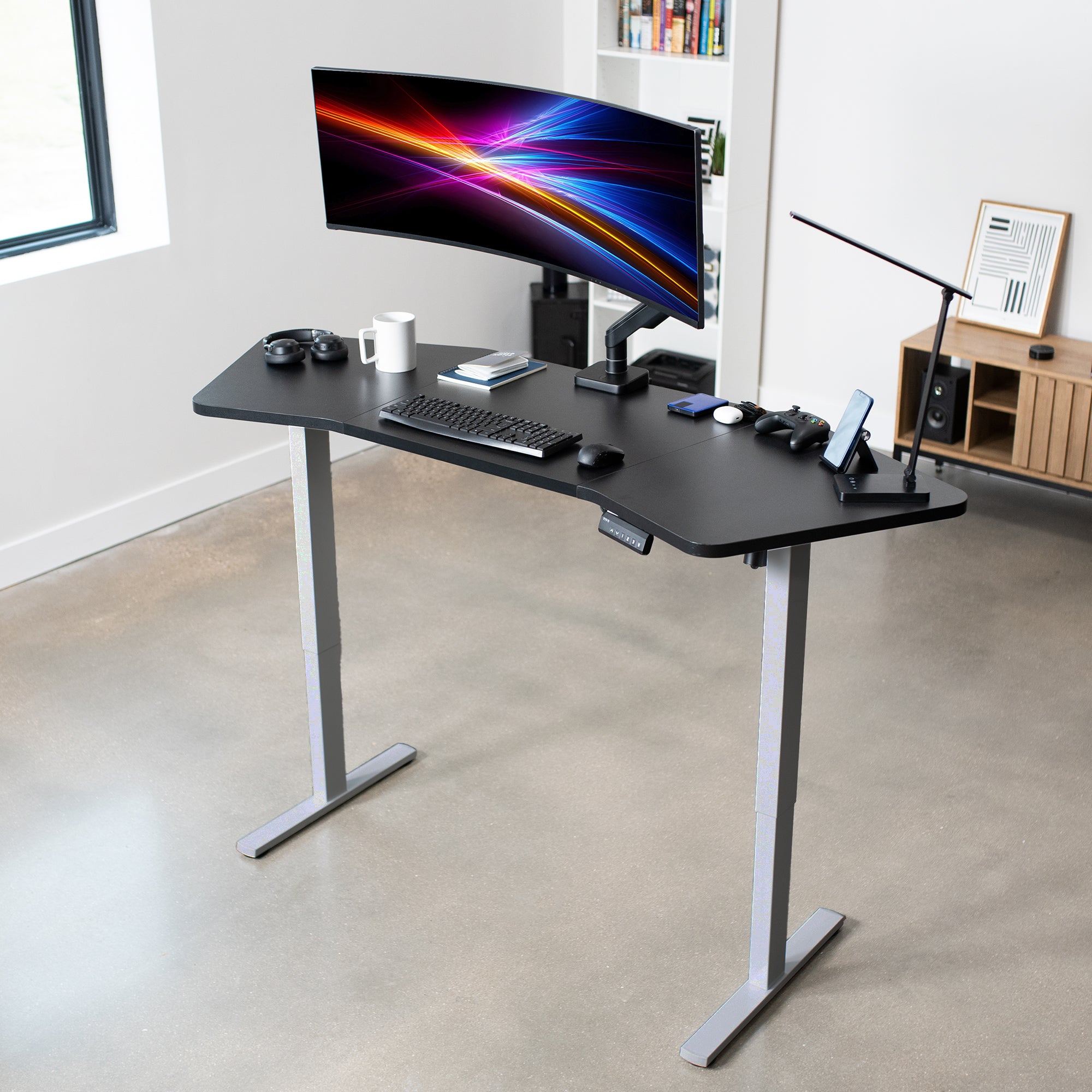 Electric Height Adjustable 71 x 24 inch Wing-Shaped Stand Up Desk for professionals working at the office or at home.