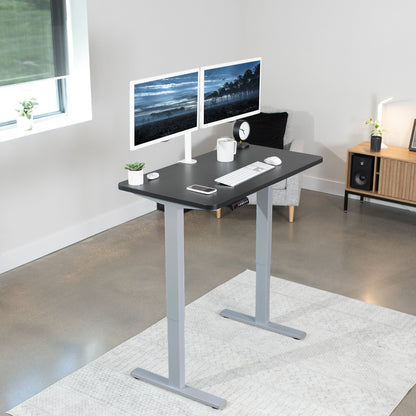 Sturdy ergonomic sit or stand active desk workstation with adjustable height using smart control panel.