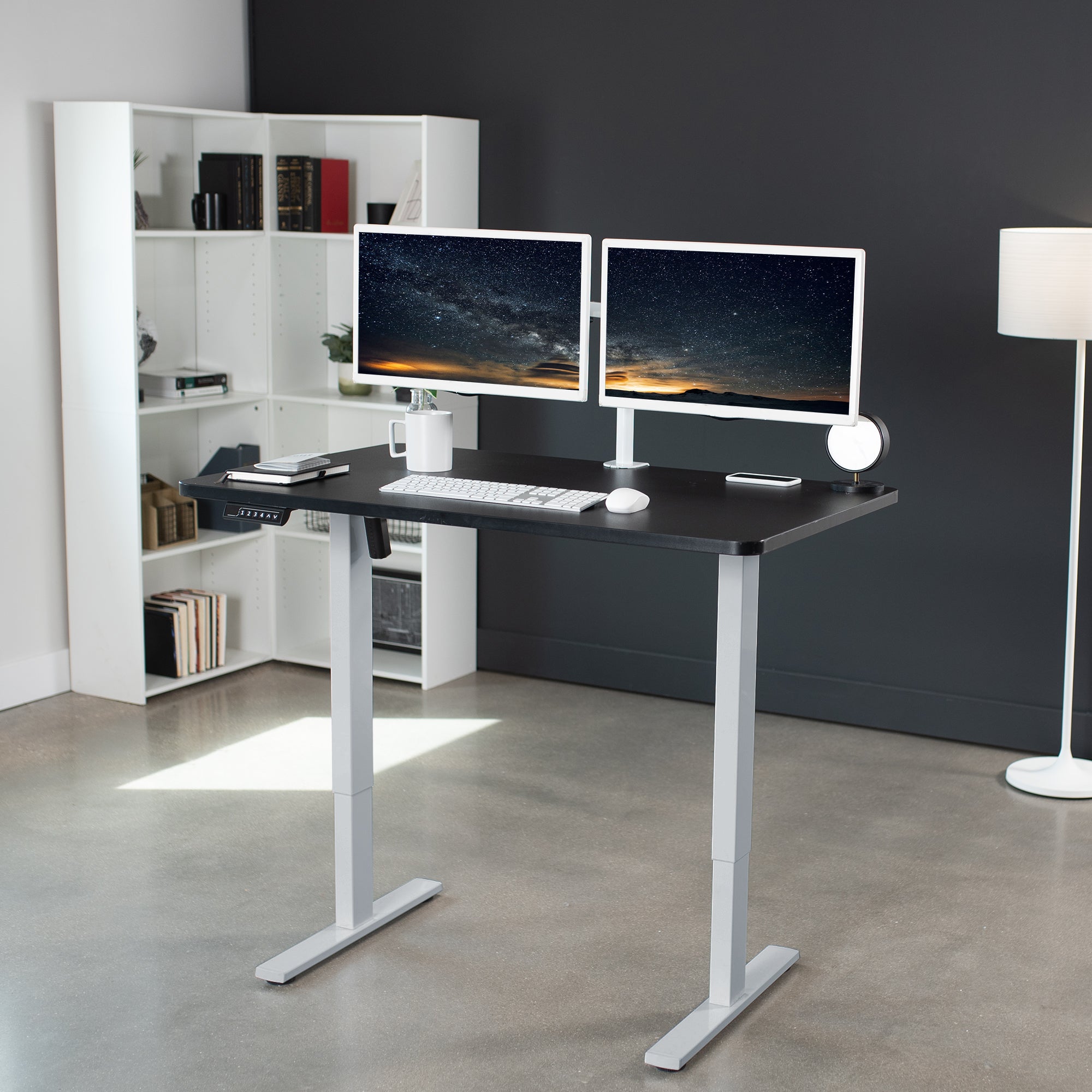 Sturdy ergonomic sit or stand active desk workstation with adjustable height using smart control panel.