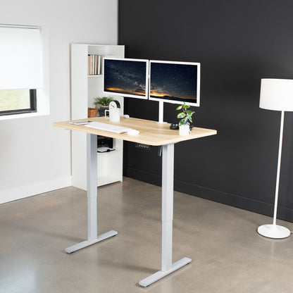 Sturdy ergonomic sit or stand active desk workstation with adjustable height using smart control panel.