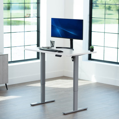 Sturdy ergonomic sit or stand active desk workstation with adjustable height using smart control panel.