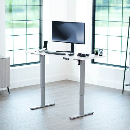 Sturdy ergonomic sit or stand active desk workstation with adjustable height using smart control panel.