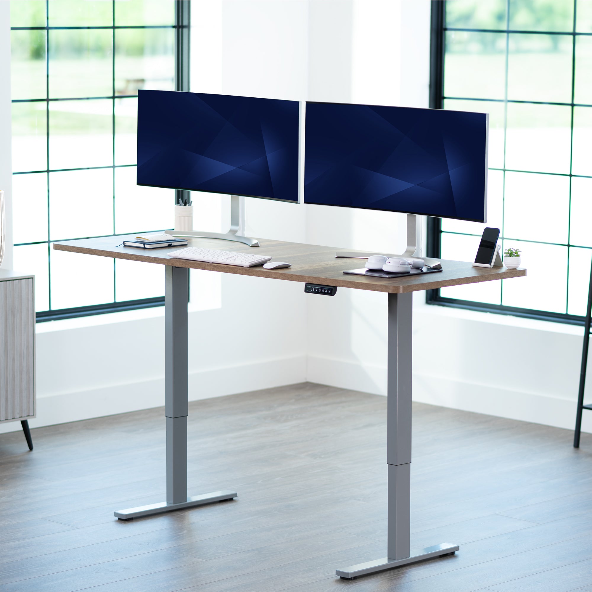 Large sturdy sit or stand modern desk with electric height adjustment options.