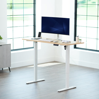 Sturdy ergonomic sit or stand active desk workstation with adjustable height using smart control panel.