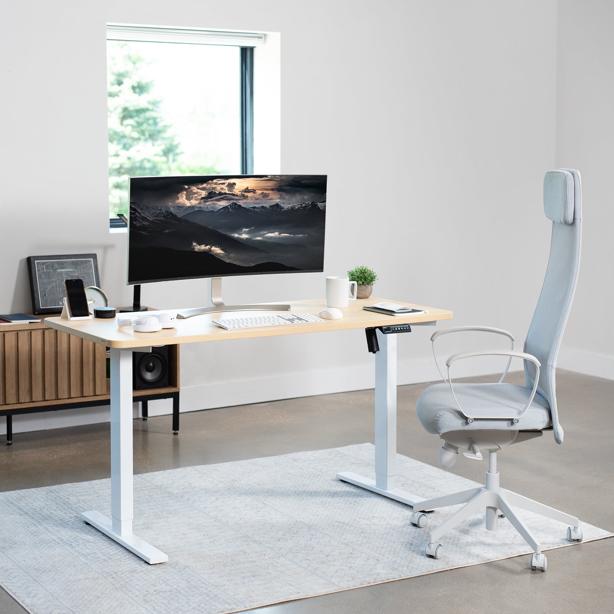 Sturdy ergonomic sit or stand active desk workstation with adjustable height using smart control panel.