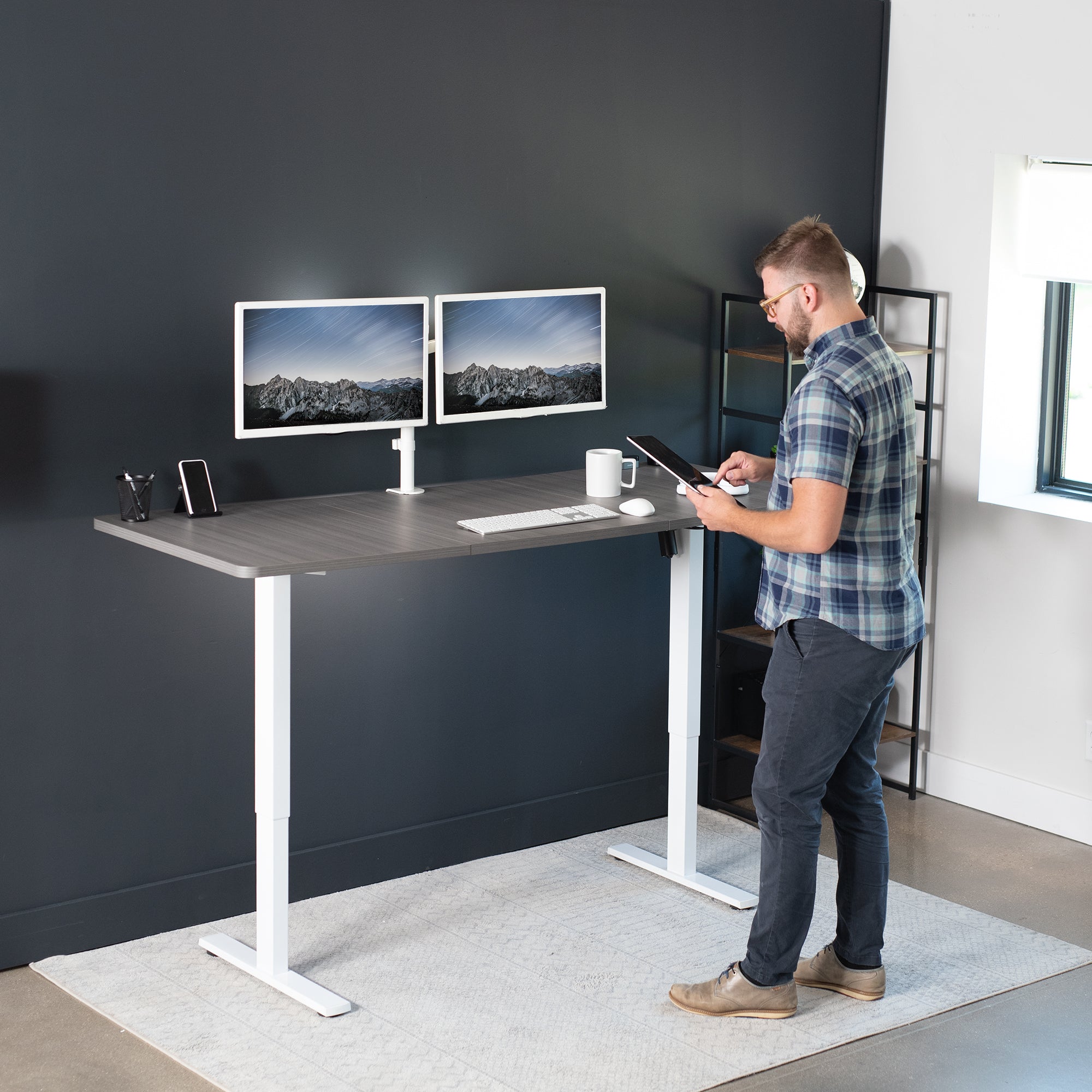 Large sturdy sit or stand active workstation with adjustable height using smart control panel.