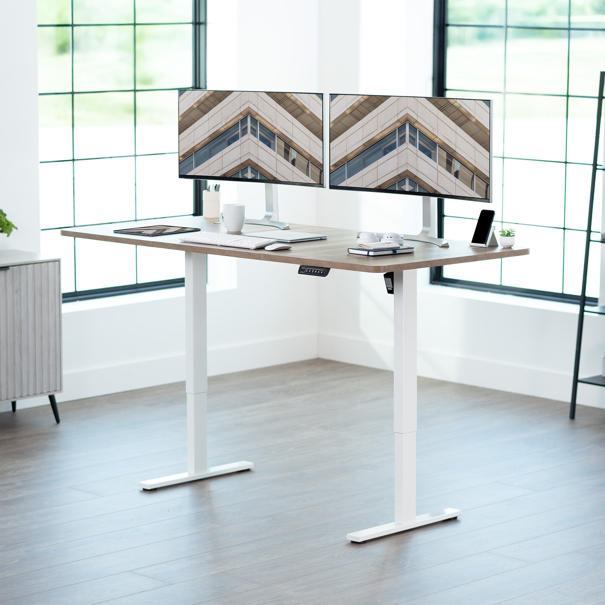 Large sturdy sit or stand modern desk with electric height adjustment options.
