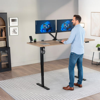 Heavy-duty electric height adjustable desktop workstation for active sit or stand efficient workspace.